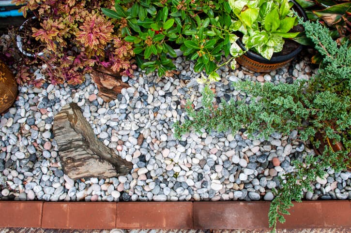 A washed rock in the garden illustrates its benefits and uses.